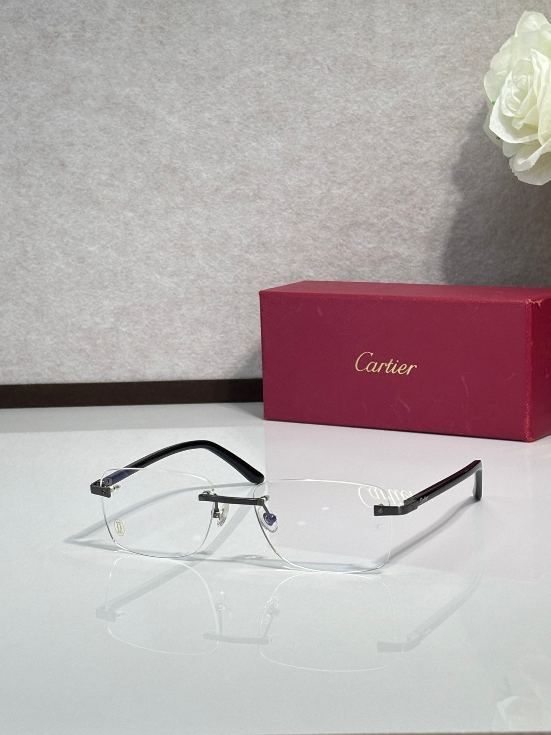 Cartier eyeglasses front view with black frame and clear lenses