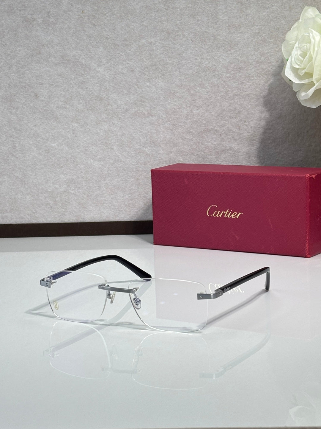 Cartier eyeglasses with black frame, clear lenses, gold accents