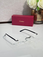 Cartier eyeglasses with black frame, clear lenses, gold hinges