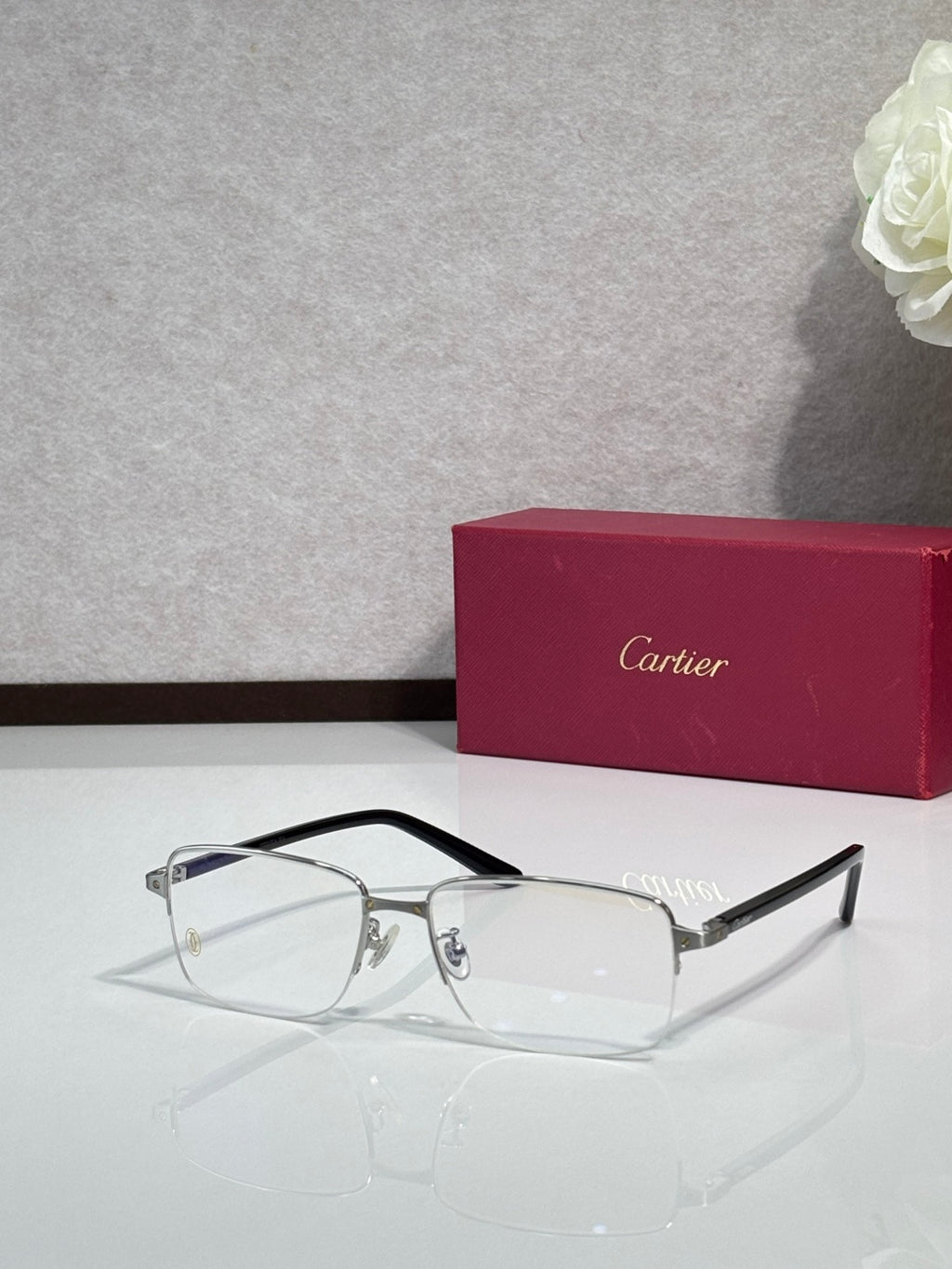 Cartier eyeglasses with black frame and clear lenses, side temple profile