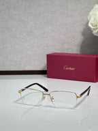 Cartier eyeglasses with gold frame and clear lenses, black temple tips
