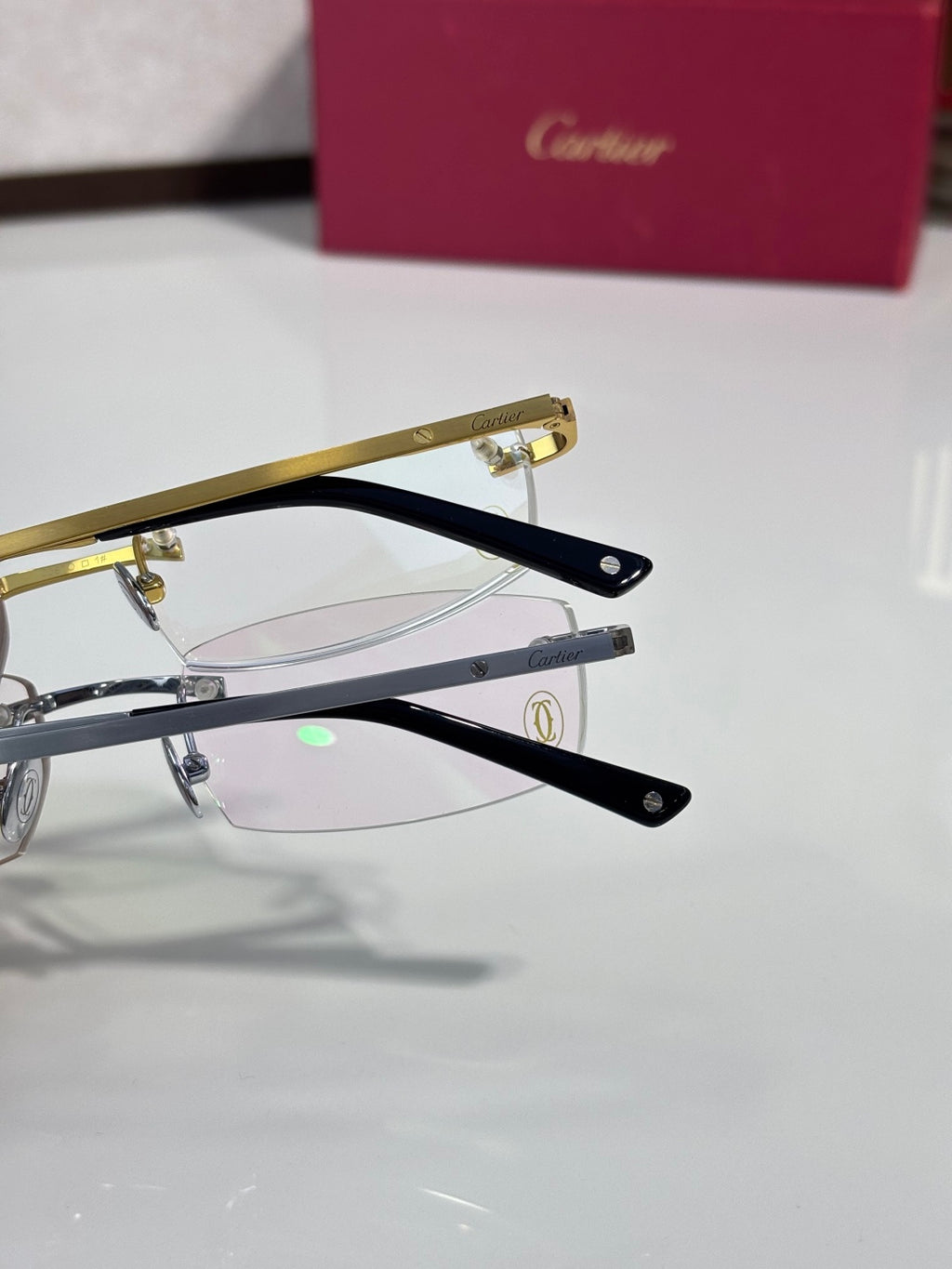 Cartier eyeglasses close-up of gold and black frames with clear lenses