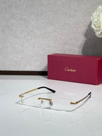 Cartier eyeglasses with gold rectangular frame and clear lenses