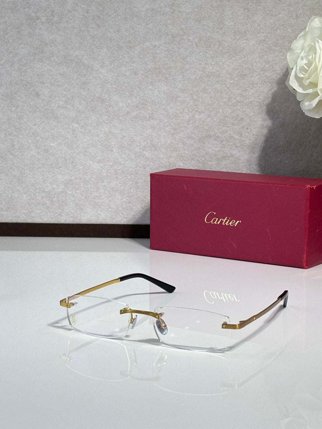 Cartier eyeglasses with gold rectangular frame and clear lenses
