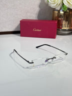 Cartier eyeglasses with black frame and clear lenses with subtle purple tint