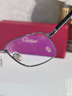 Black eyeglasses frame with purple-tinted lens and metal temple logo