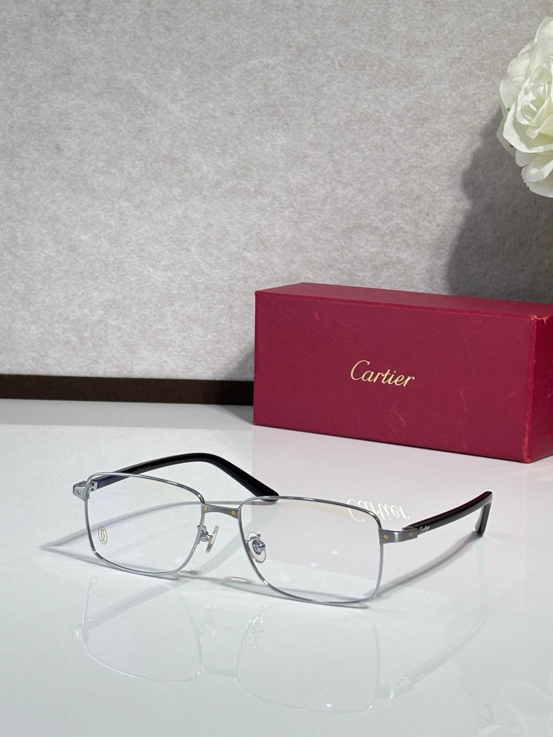 Gunmetal rectangular eyeglasses with clear lenses and metal bridge