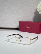 Two-tone gold and black rectangular eyeglasses with clear lenses