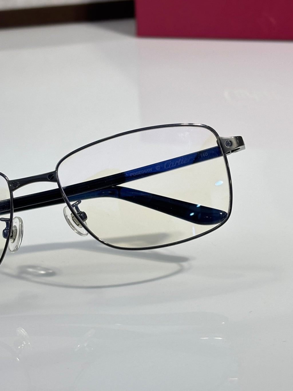 Blue temple bar eyeglasses with black frame and clear lens
