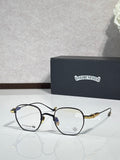 Black and gold round eyeglasses with clear lenses and metal nose bridge.
