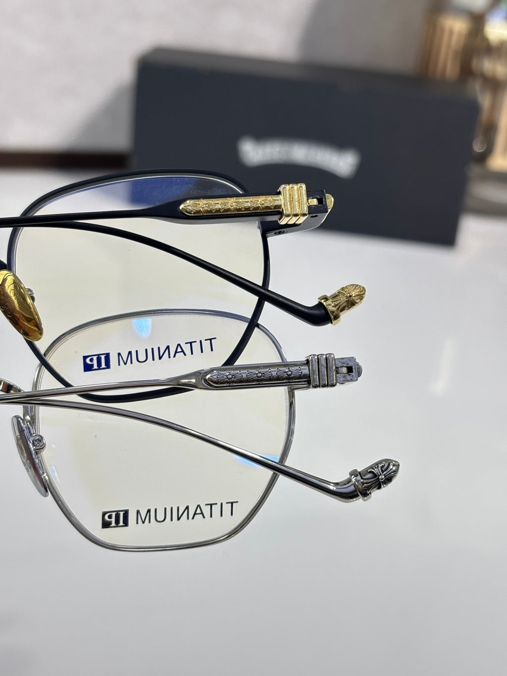 Pair of round eyeglasses: black frame and silver frame with gold temple tips.