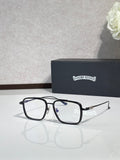Black rectangular eyeglasses with clear lenses and blue accent on temples.