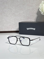 Black rectangular eyeglasses with clear lenses and blue accent on temples.
