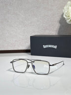 Black rectangular eyeglasses with silver-toned hinges and clear lenses.