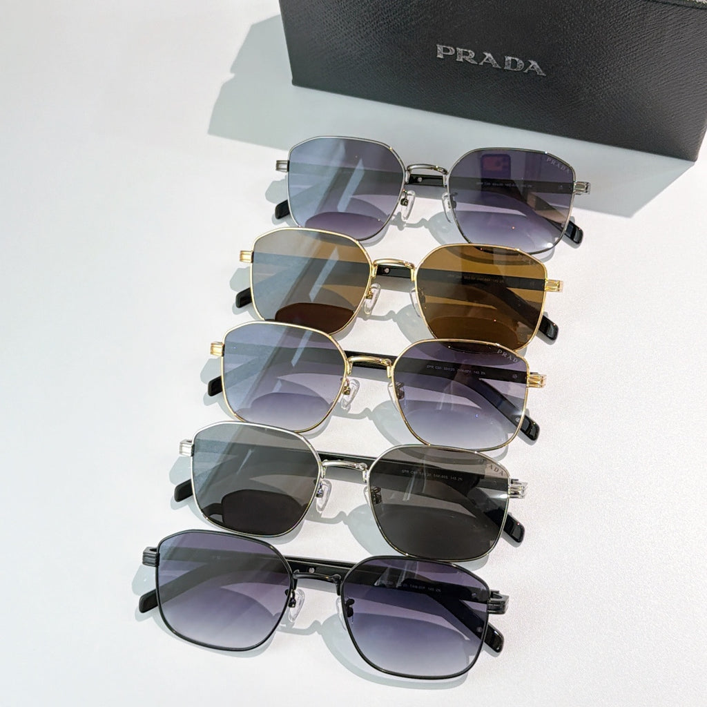 Stacked sunglasses with tinted lenses in mixed frames: black, gold, and silver.