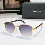 Sunglasses with purple tinted lenses and gold frame with black temple tips.