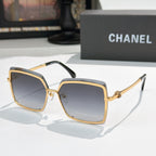 Square sunglasses with gold frame and dark gray lenses