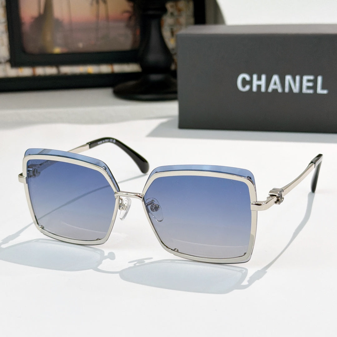 Square sunglasses with silver frame and blue tinted lenses