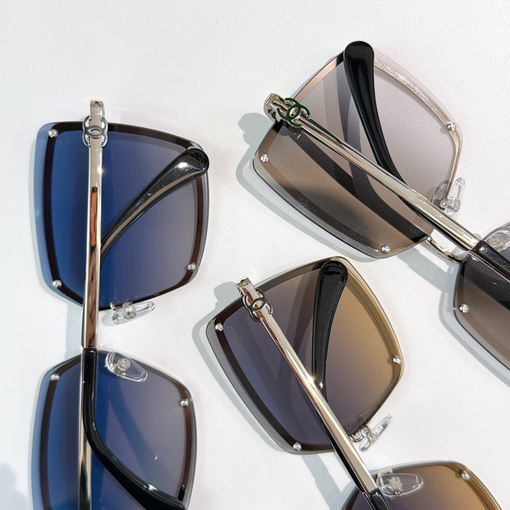 Multiple square sunglasses with blue, black, and brown gradient lenses
