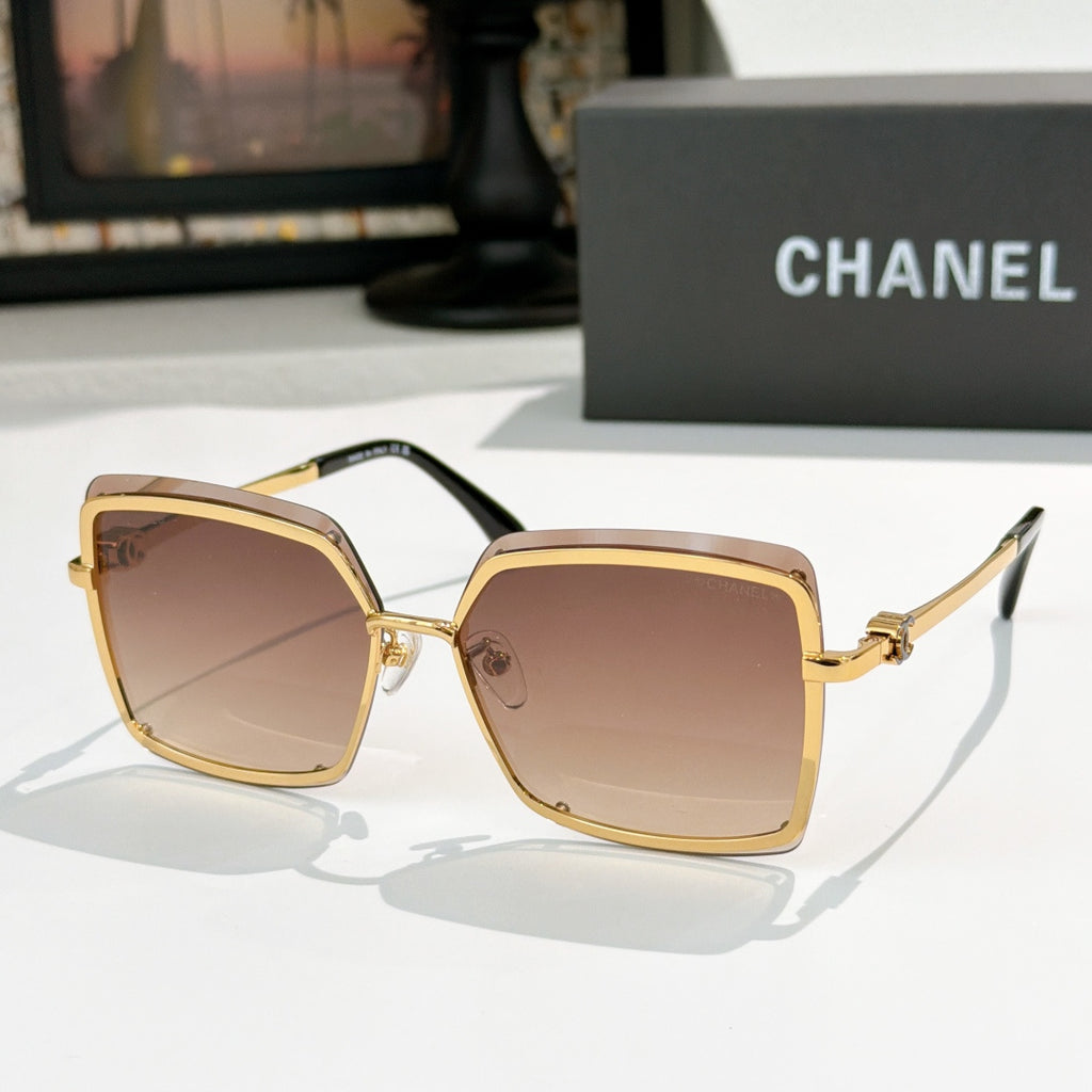 Square sunglasses with gold frame and amber-brown lenses