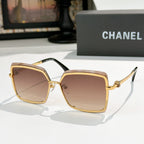 Square sunglasses with gold frame and amber-brown lenses