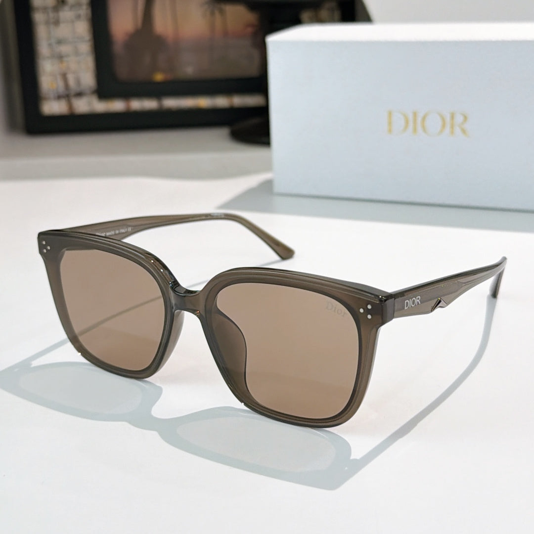 Tortoiseshell sunglasses with dark lenses and star-like metal accents on temples
