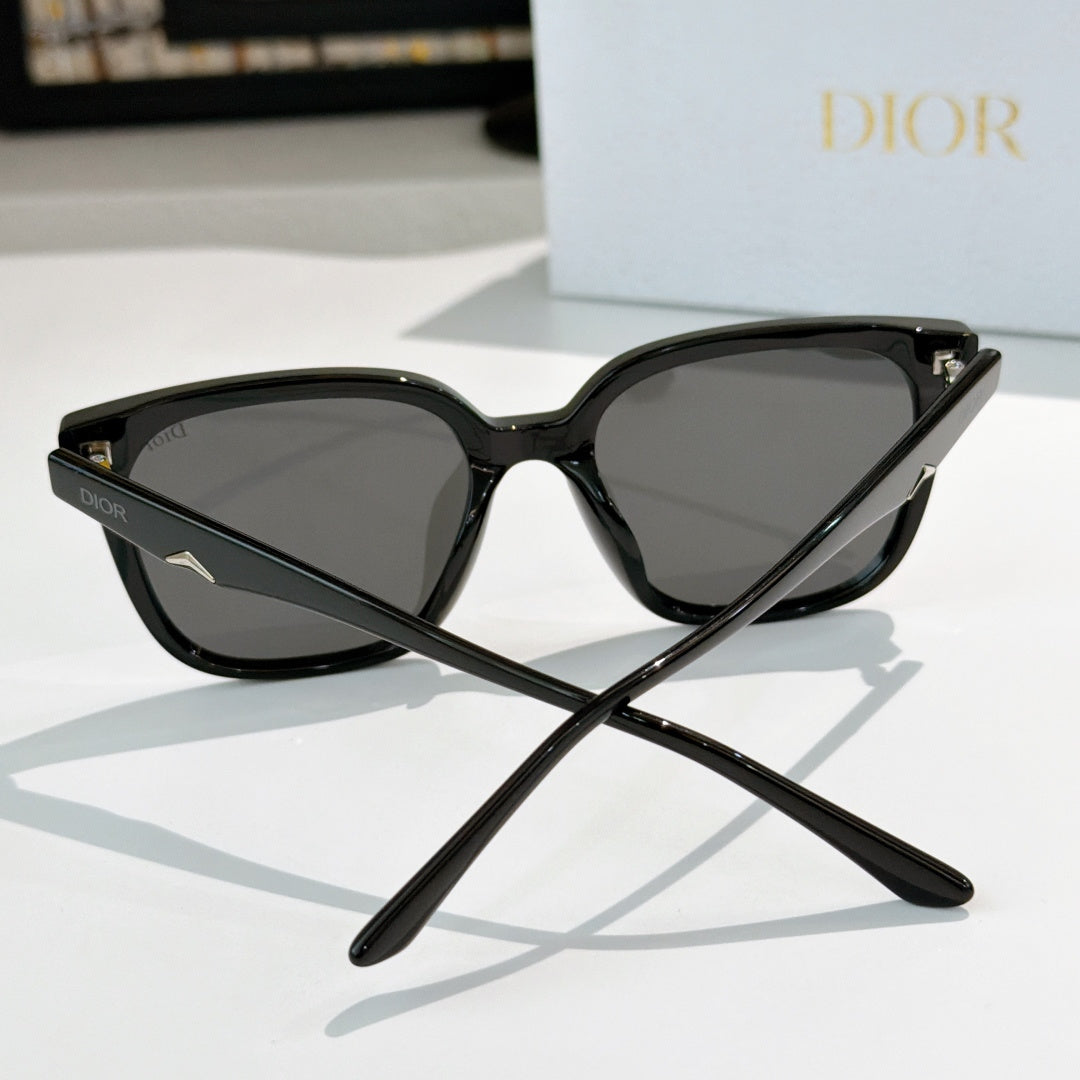 Black cat-eye sunglasses with dark lenses and star-like metal detail at the temple