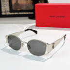 Celine sunglasses with dark lenses and clear frame, silver-tone metal temples.