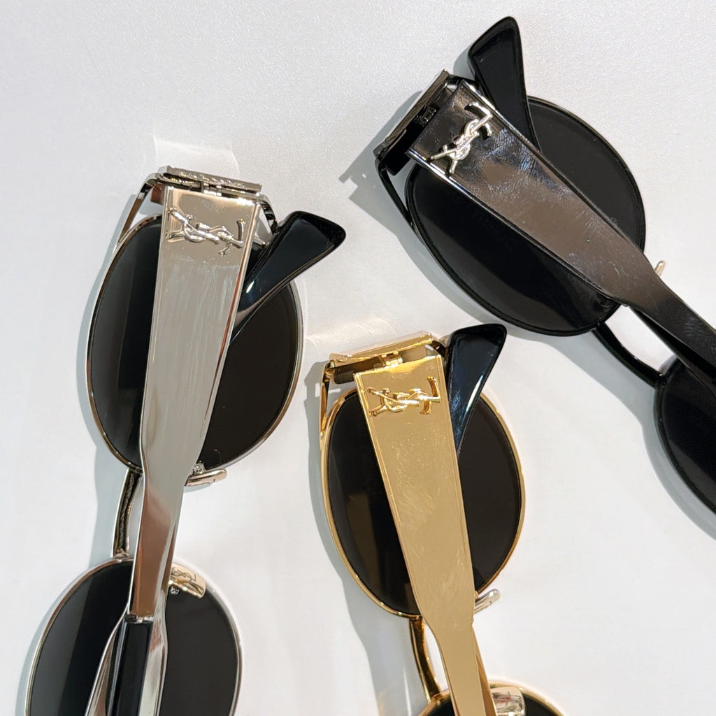 Celine sunglasses close-up set: gold and black frames with dark lenses and metal details.