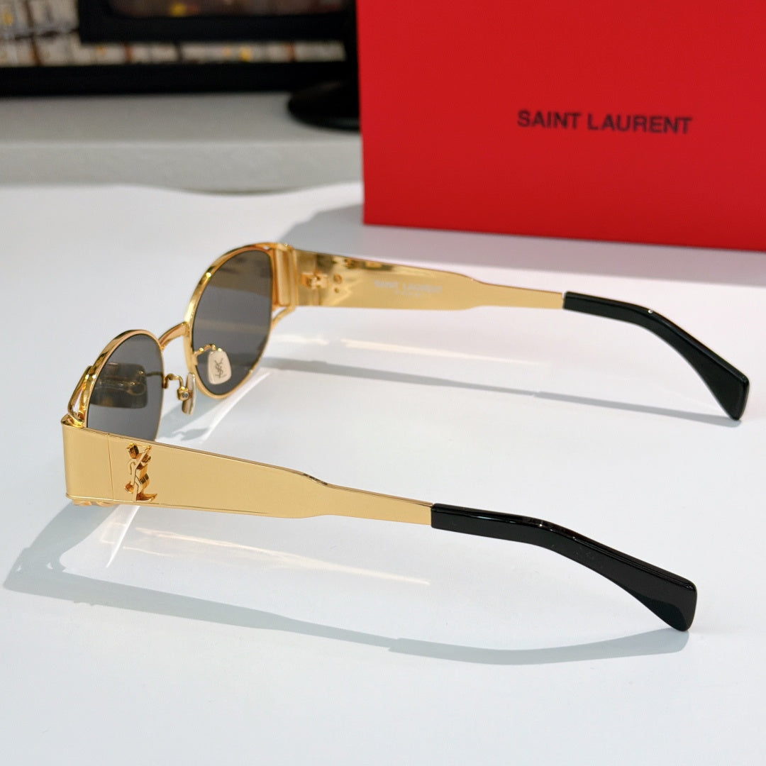 Celine sunglasses side view with gold-tone frame, clear lens tint, black temple arms.