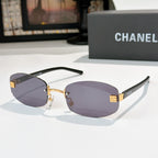 Chanel glasses with dark purple lenses, gold details and black temples