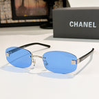 Chanel glasses with blue lenses, gold details and black temples