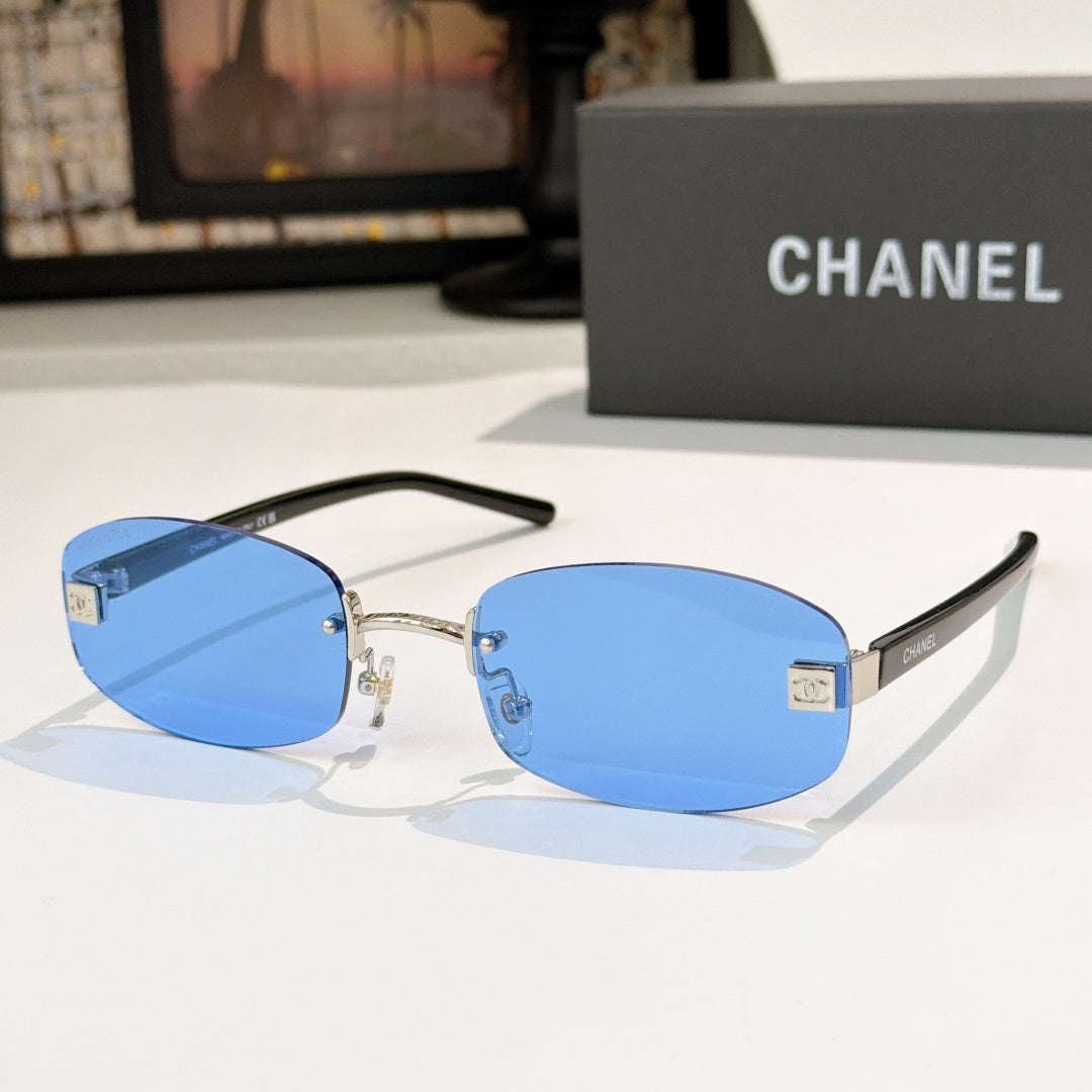 Chanel glasses with blue lenses, gold details and black temples