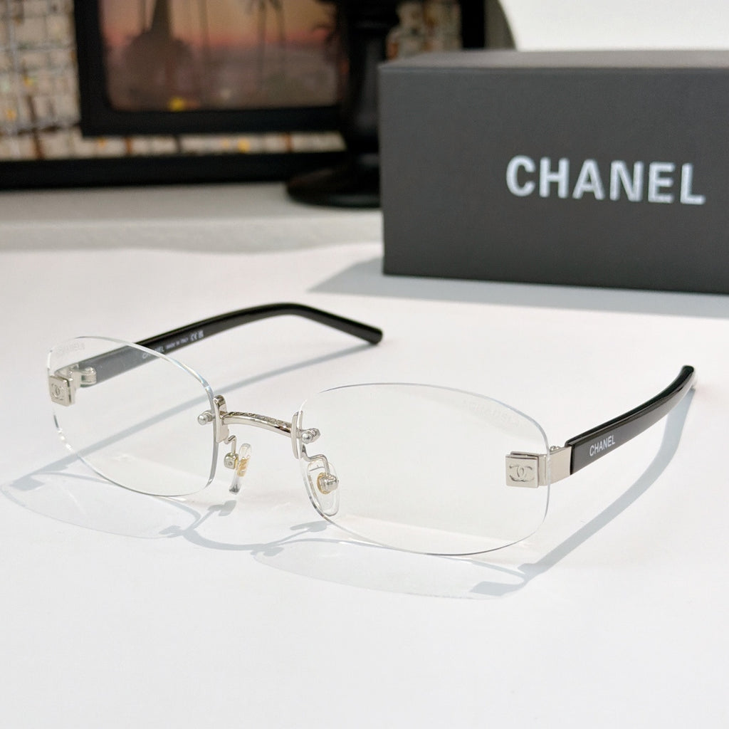 Chanel glasses with clear lenses, gold metal frame and black temples