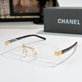 Chanel glasses with clear lenses, gold bridge and black temples