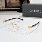 Chanel glasses with clear lenses, gold bridge and black temples