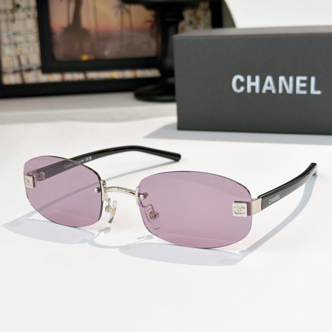 Chanel glasses with mauve purple lenses, silver frame and black temples