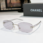 Chanel glasses with light purple lenses, silver frame and black temples