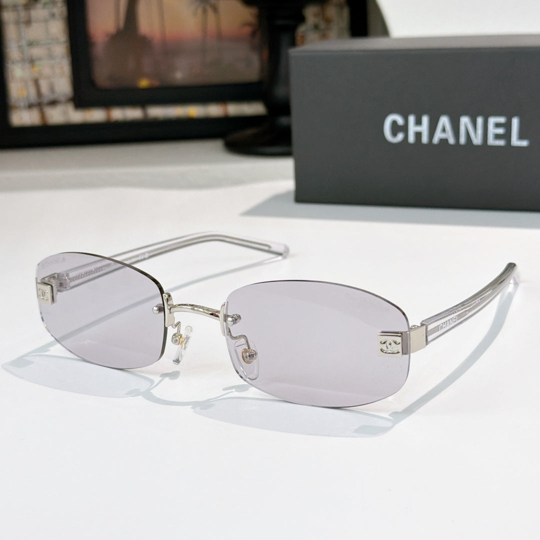 Chanel glasses with light purple lenses, silver frame and black temples