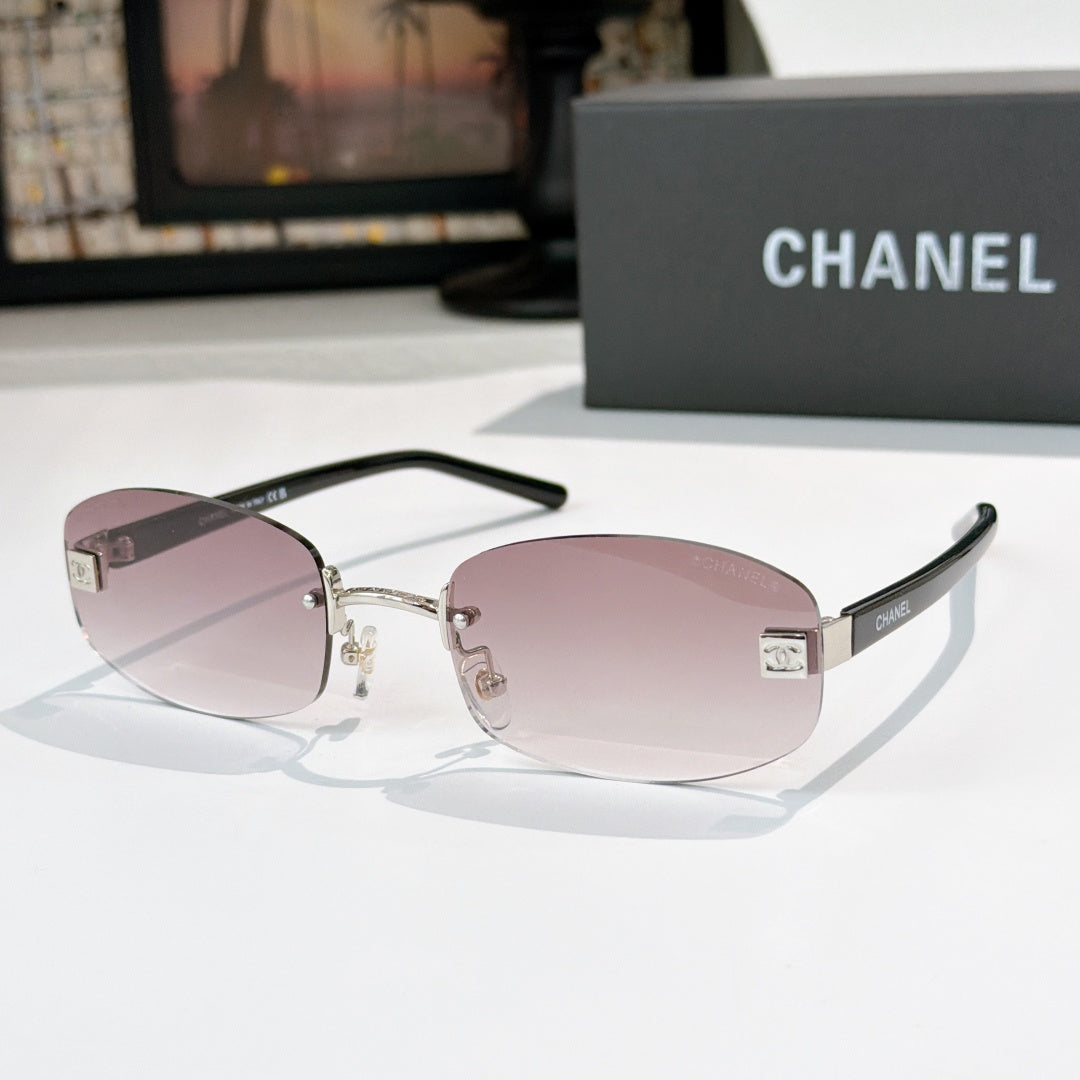 Chanel glasses with pink lenses, silver frame and black temples