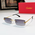 Cartier glasses with gold frame, dark blue tinted lenses, black temples, rectangular.