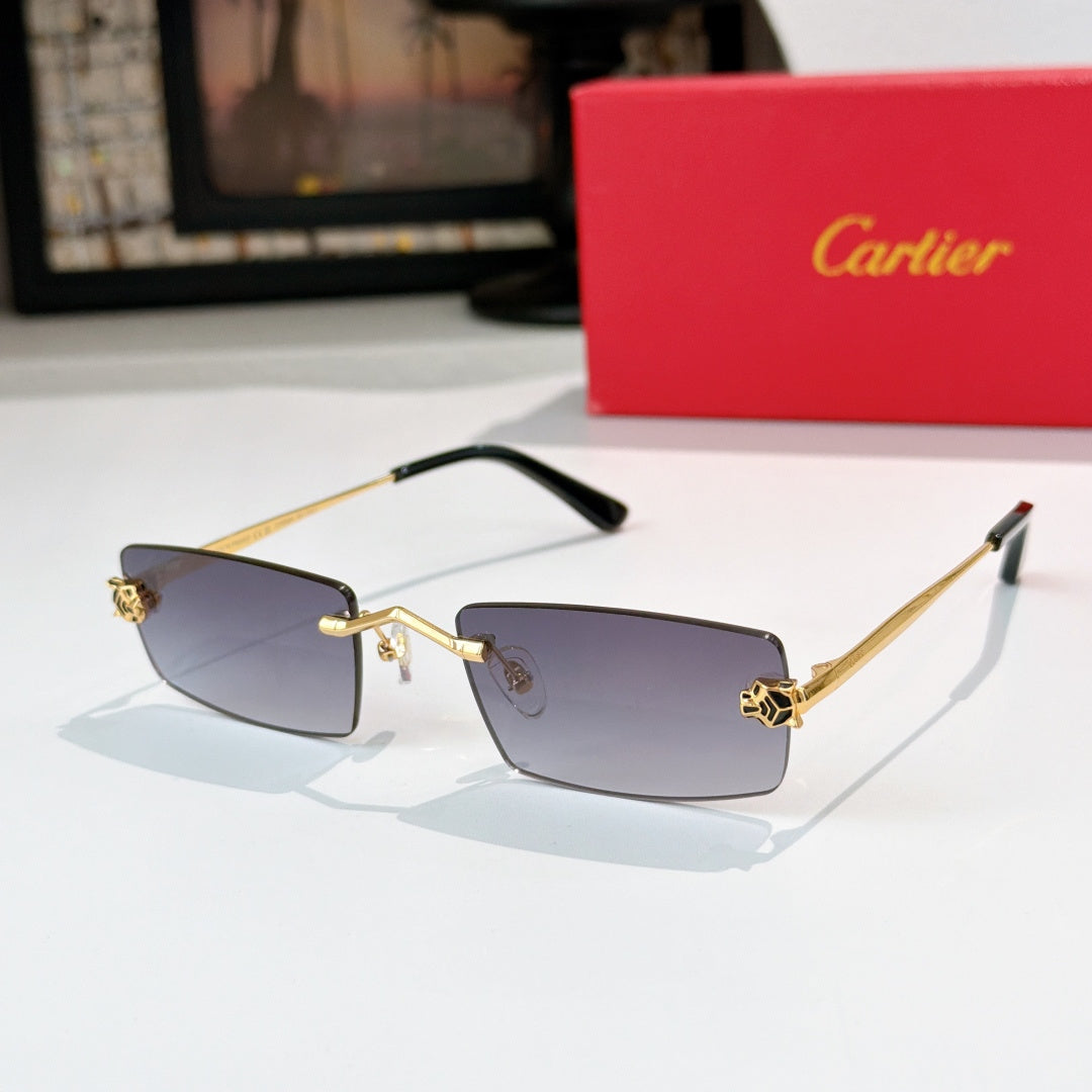 Cartier glasses with gold frame, dark blue tinted lenses, black temples, rectangular.