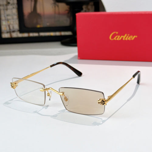 Cartier glasses with gold frame, light tinted lenses, dark temples, rectangular shape.
