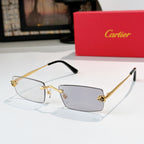 Cartier glasses with gold frame, clear lenses, black temples, rectangular silhouette.