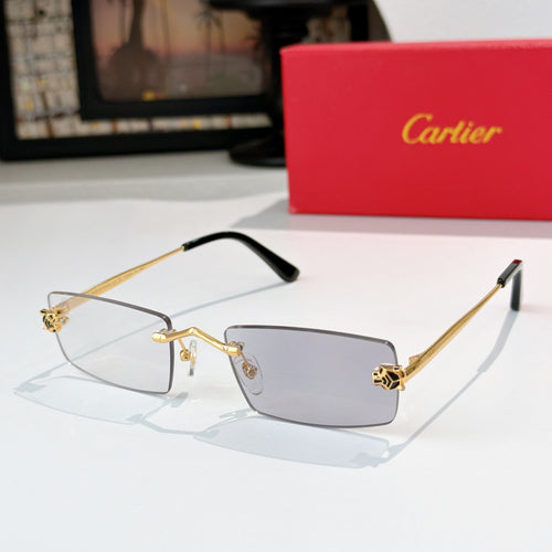 Cartier glasses with gold frame, clear lenses, black temples, rectangular silhouette.