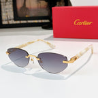 Cartier aviator sunglasses with translucent gold frame and dark gray lenses