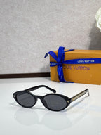 Louis Vuitton cat-eye sunglasses with black frame and dark lenses, star-detail temples