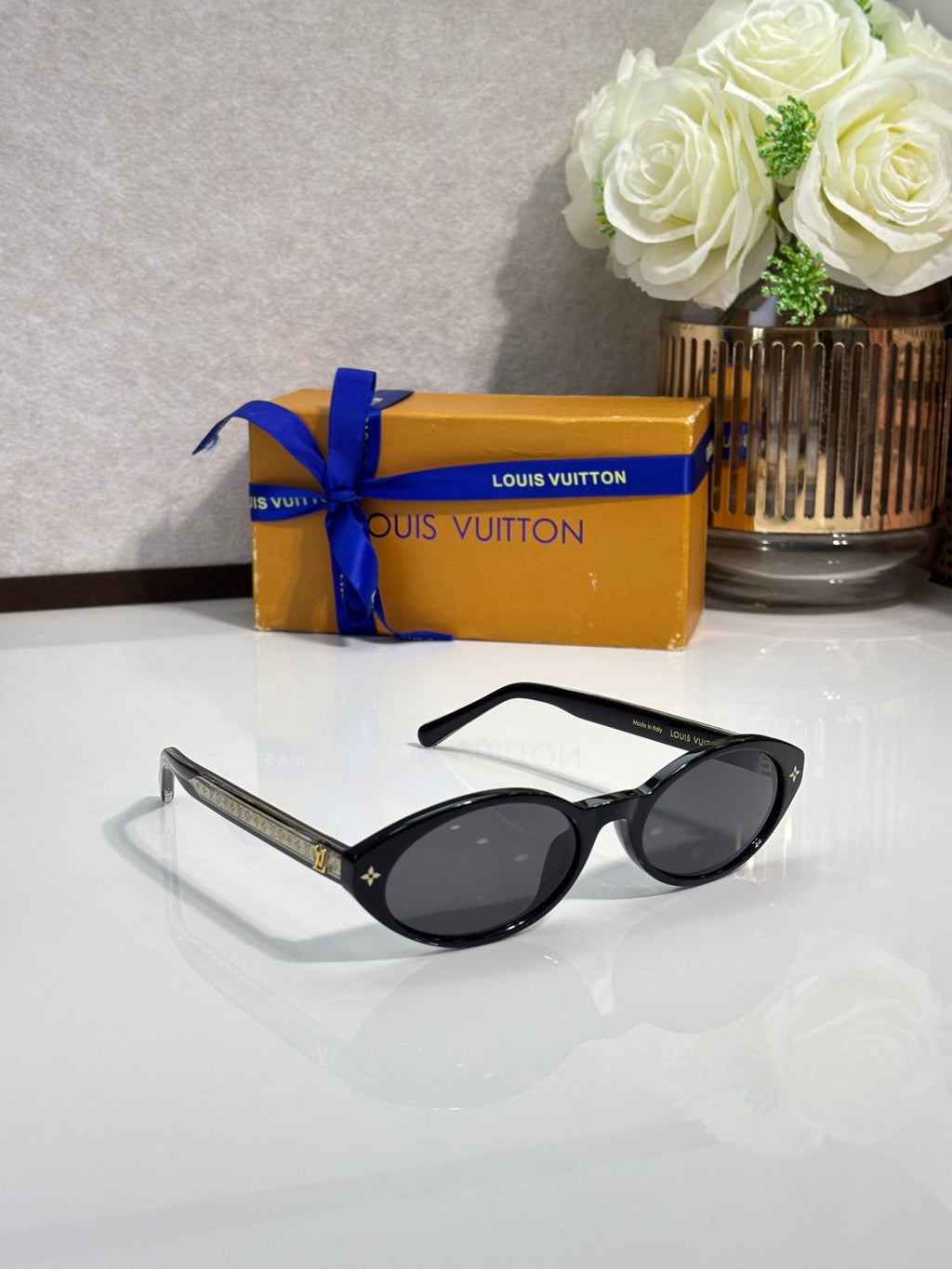 Louis Vuitton cat-eye sunglasses, black frame with dark lenses and clear temple arms