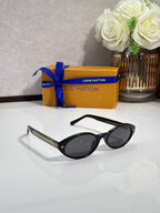 Louis Vuitton cat-eye sunglasses, black frame with dark lenses and clear temple arms