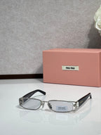 MiuMiu silver eyeglass frame with black temples and light gray lenses